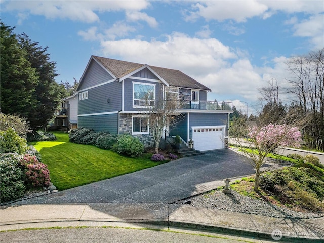660 Parkside Pl, Blaine, WA 98230 - view of front facade featuring stone siding, a garage, aphalt driveway, a balcony, and a front lawn