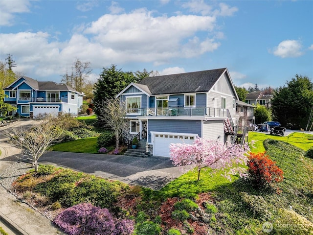 660 Parkside Pl, Blaine, WA 98230 - view of front of home featuring a garage, stairway, driveway, and board and batten siding
