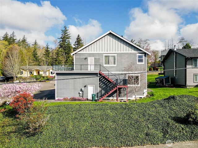 660 Parkside Pl, Blaine, WA 98230 - rear view of house with stairway, board and batten siding, and a lawn