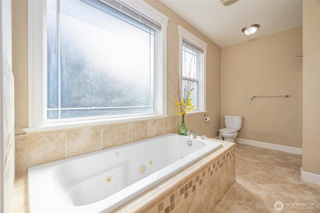 660 Parkside Pl, Blaine, WA 98230 - bathroom with tile patterned flooring, a jetted tub, baseboards, and toilet