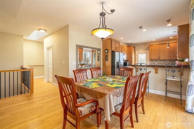 660 Parkside Pl, Blaine, WA 98230 - dining space featuring baseboards, recessed lighting, light wood-style floors, and a healthy amount of sunlight