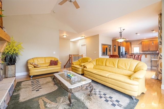 660 Parkside Pl, Blaine, WA 98230 - living area with light wood-style flooring, ceiling fan, baseboards, and lofted ceiling