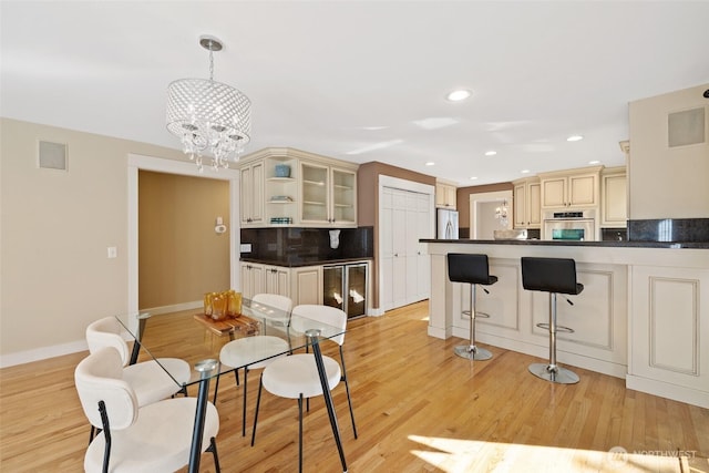 interior space featuring visible vents, recessed lighting, a chandelier, and light wood-style floors