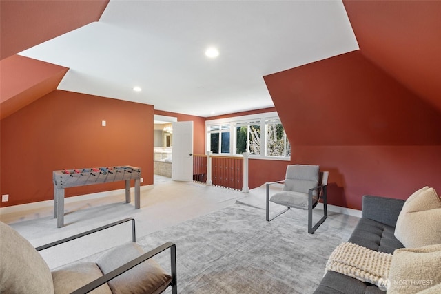 interior space featuring recessed lighting, carpet floors, baseboards, and lofted ceiling
