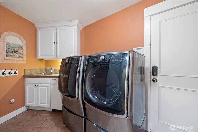 laundry room with independent washer and dryer, a sink, tile patterned floors, baseboards, and cabinet space