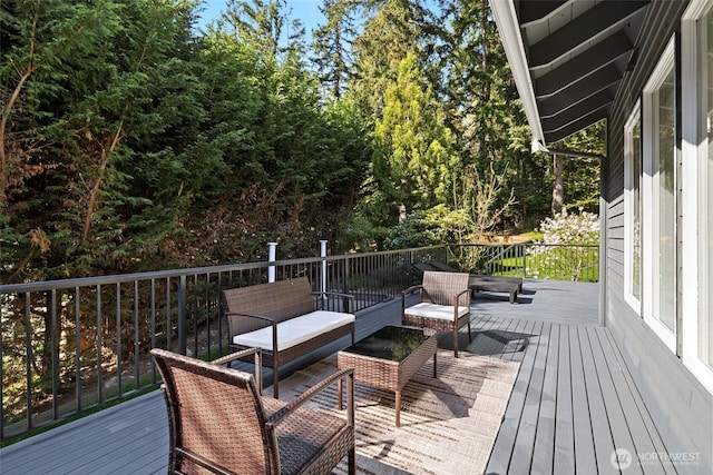 wooden deck featuring an outdoor hangout area