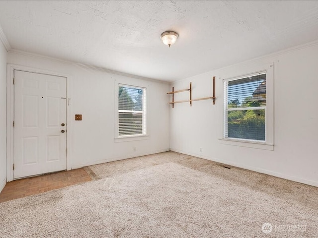 8434 34th Ave S, Seattle, WA 98118 - spare room featuring crown molding and baseboards
