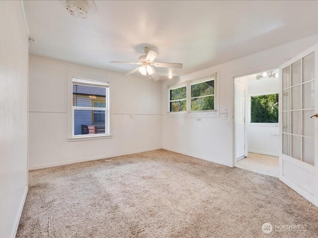 8434 34th Ave S, Seattle, WA 98118 - carpeted spare room with a ceiling fan and baseboards