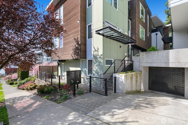 3929 2nd Ave NE, Seattle, WA 98105 - exterior space featuring an attached garage and driveway