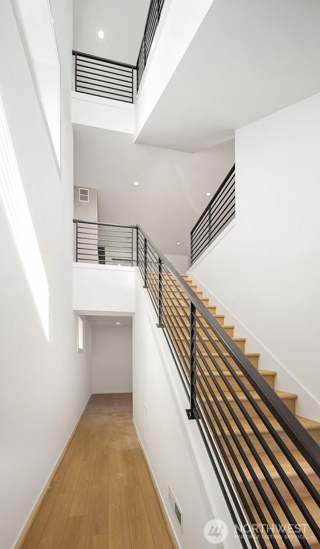 25520LOT22 204th Pl SE, Covington, WA 98042 - stairway with visible vents, a high ceiling, recessed lighting, and wood-type flooring