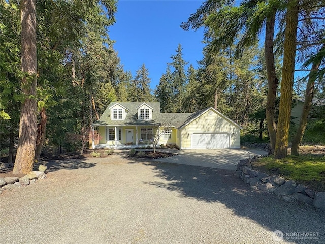 861 Kirner Rd, Sequim, WA 98382 - cape cod-style house with a porch, driveway, and a garage