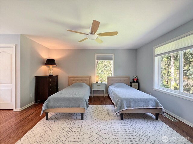 861 Kirner Rd, Sequim, WA 98382 - bedroom featuring baseboards, ceiling fan, and wood finished floors