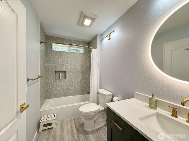861 Kirner Rd, Sequim, WA 98382 - bathroom with wood finished floors, toilet, shower / bath combo with shower curtain, and vanity