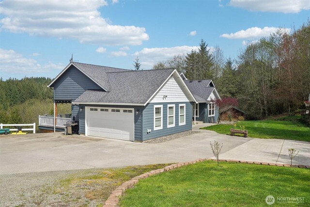 14900 NE Critter Hill Dr, Amboy, WA 98601 - view of front facade featuring concrete driveway, a shingled roof, a front lawn, and a garage