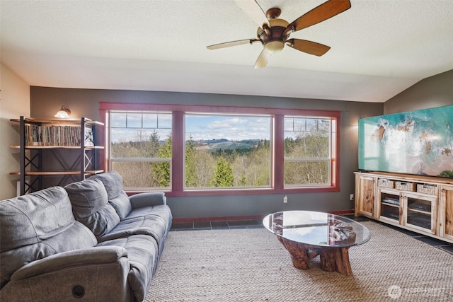 14900 NE Critter Hill Dr, Amboy, WA 98601 - living area featuring plenty of natural light, a ceiling fan, lofted ceiling, and baseboards