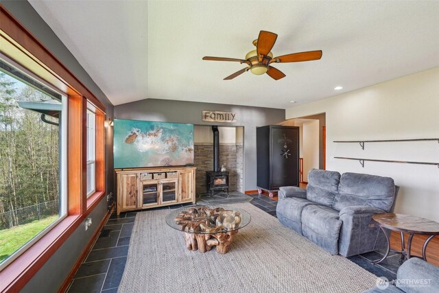14900 NE Critter Hill Dr, Amboy, WA 98601 - living area with a wood stove, vaulted ceiling, a ceiling fan, and recessed lighting