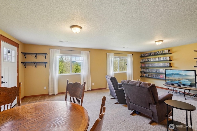 14900 NE Critter Hill Dr, Amboy, WA 98601 - dining area featuring healthy amount of natural light, a textured ceiling, and baseboards