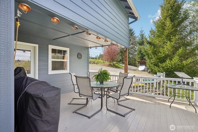 14900 NE Critter Hill Dr, Amboy, WA 98601 - deck featuring outdoor dining area