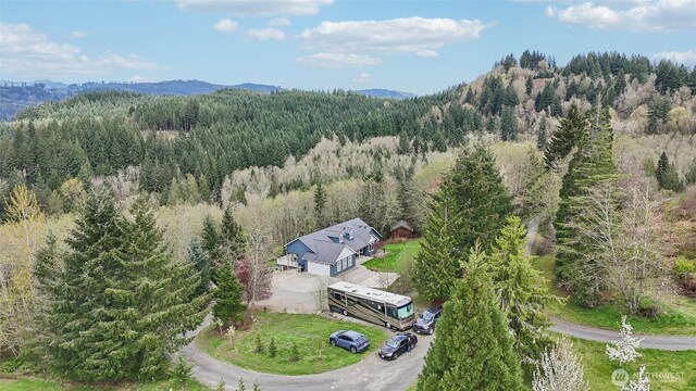 14900 NE Critter Hill Dr, Amboy, WA 98601 - aerial view of property and surrounding area featuring a heavily wooded area and a mountain backdrop