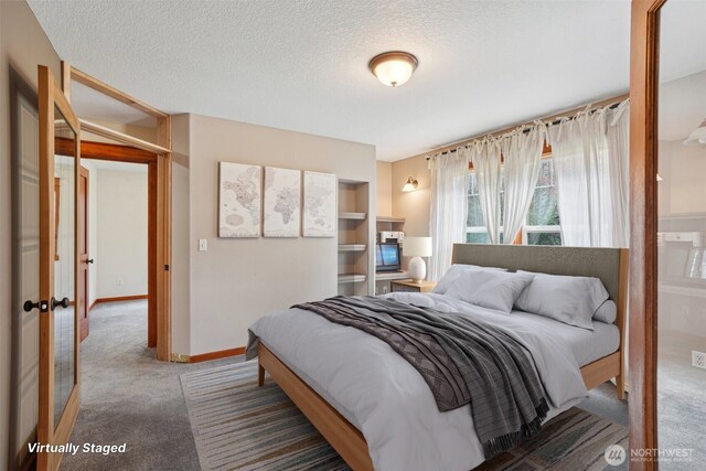 14900 NE Critter Hill Dr, Amboy, WA 98601 - bedroom with carpet floors, a textured ceiling, and baseboards