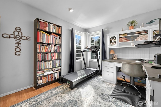 office featuring light wood-type flooring and baseboards