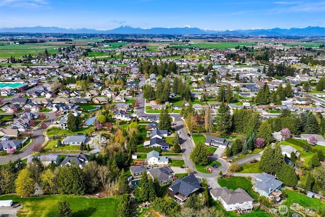 birds eye view of property featuring a mountain view and a residential view