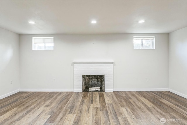 201 S 60th St, Tacoma, WA 98408 - unfurnished living room featuring a wealth of natural light, recessed lighting, baseboards, and wood finished floors