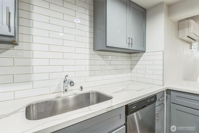 201 S 60th St, Tacoma, WA 98408 - kitchen featuring tasteful backsplash, a sink, gray cabinets, stainless steel dishwasher, and light stone counters