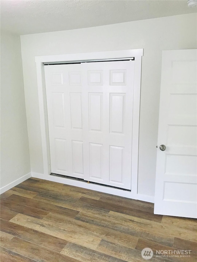 201 S 60th St, Tacoma, WA 98408 - interior space with baseboards and wood finished floors