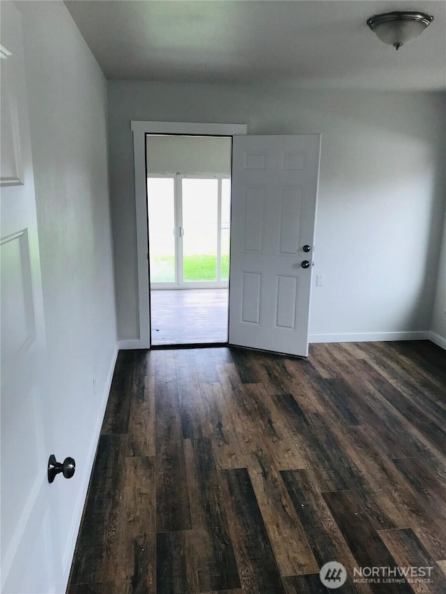 201 S 60th St, Tacoma, WA 98408 - unfurnished room with dark wood-type flooring and baseboards