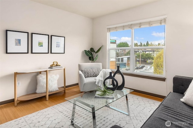 413 NE 70th St Unit 402, Seattle, WA 98115 - sitting room featuring baseboards and wood finished floors