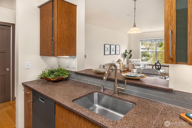 413 NE 70th St Unit 402, Seattle, WA 98115 - kitchen with dishwasher, a sink, and brown cabinets