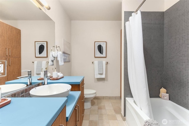 413 NE 70th St Unit 402, Seattle, WA 98115 - bathroom with baseboards, toilet, shower / bath combination with curtain, and vanity