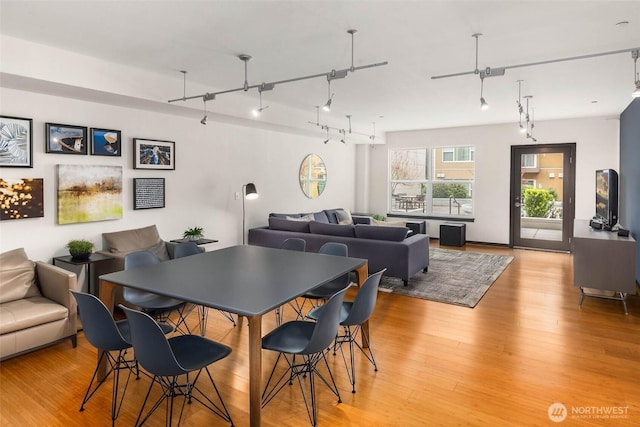 413 NE 70th St Unit 402, Seattle, WA 98115 - dining space featuring track lighting and light wood-style floors