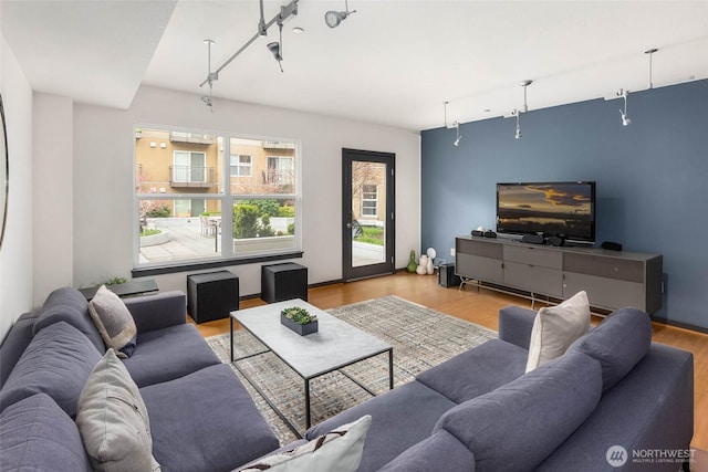 413 NE 70th St Unit 402, Seattle, WA 98115 - living room with rail lighting and wood finished floors