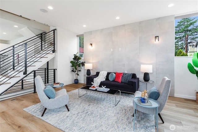 3111 Queen Anne Ave N, Seattle, WA 98119 - living room with recessed lighting, stairway, wood finished floors, and baseboards