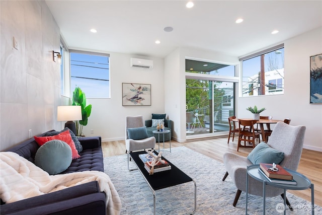 3111 Queen Anne Ave N, Seattle, WA 98119 - living room with recessed lighting, an AC wall unit, baseboards, and wood finished floors
