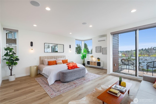 3111 Queen Anne Ave N, Seattle, WA 98119 - bedroom featuring access to exterior, recessed lighting, light wood-style floors, and a wall mounted air conditioner