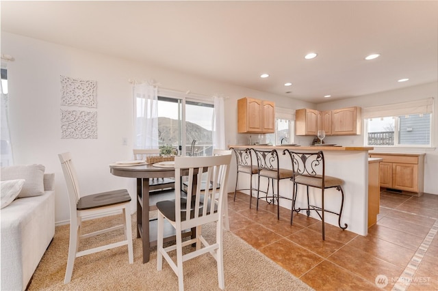 dining space with recessed lighting and light tile patterned floors