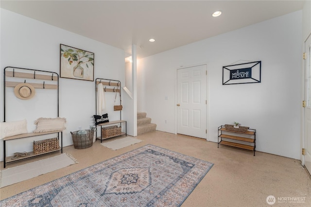 interior space with recessed lighting and stairs