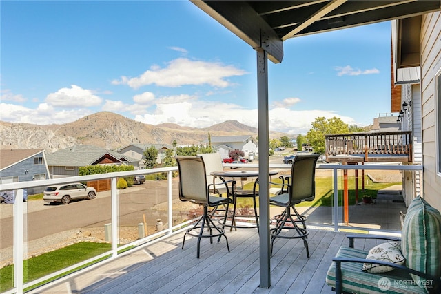 wooden terrace with a mountain view