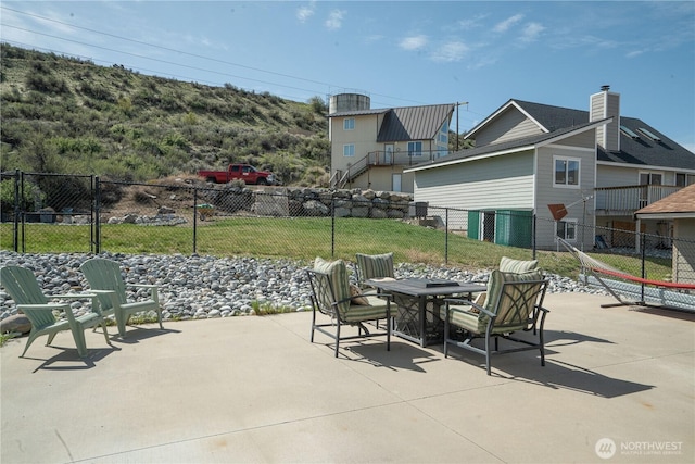 view of patio / terrace featuring fence
