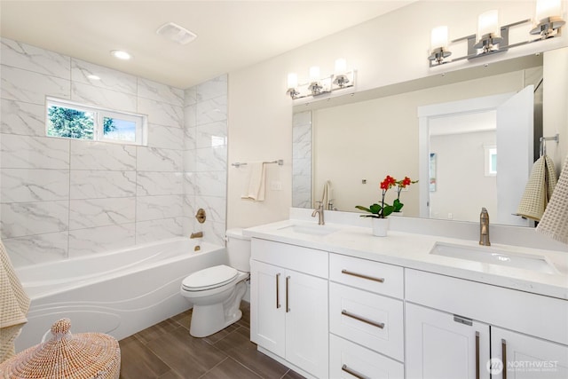 10410 2nd Pl SW, Seattle, WA 98146 - full bath with double vanity, toilet, visible vents, and a sink