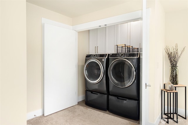 10410 2nd Pl SW, Seattle, WA 98146 - laundry area featuring baseboards, laundry area, washing machine and dryer, and light colored carpet