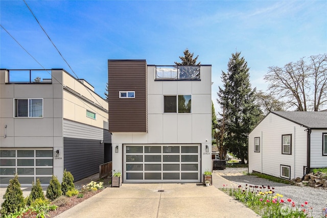 10410 2nd Pl SW, Seattle, WA 98146 - contemporary home with a garage, board and batten siding, and driveway