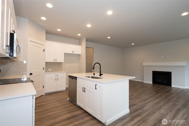 27105 30th Pl S Unit 21, Kent, WA 98032 - kitchen with visible vents, a sink, dark wood finished floors, a center island with sink, and stainless steel appliances