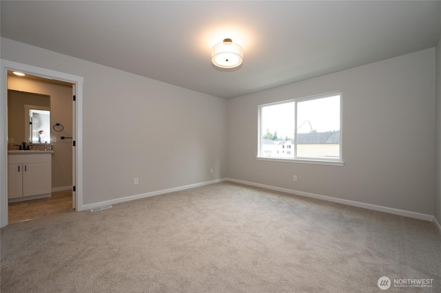 27105 30th Pl S Unit 21, Kent, WA 98032 - empty room featuring a sink, light colored carpet, baseboards, and visible vents