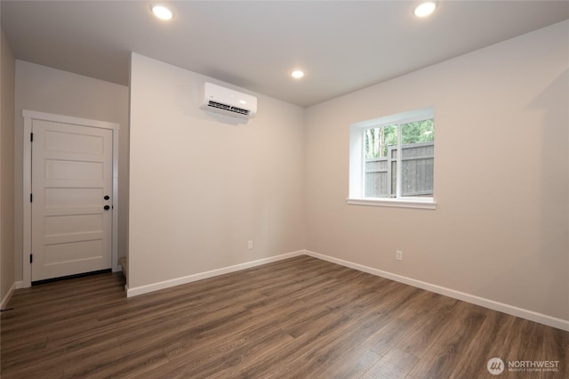27105 30th Pl S Unit 21, Kent, WA 98032 - empty room featuring dark wood-type flooring, a wall mounted air conditioner, baseboards, and recessed lighting