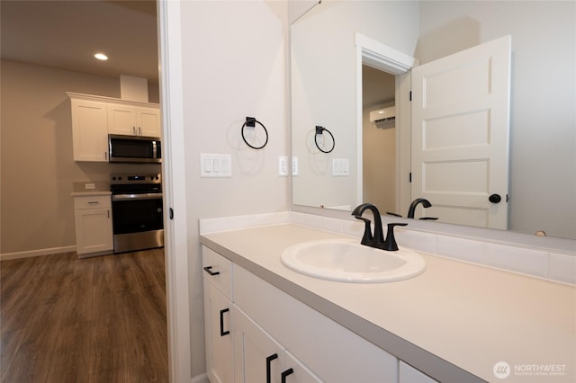 27105 30th Pl S Unit 21, Kent, WA 98032 - bathroom with recessed lighting, vanity, wood finished floors, and a wall mounted air conditioner