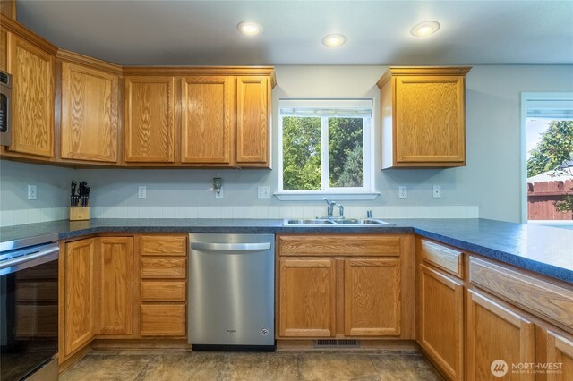 2335 Hawk Dr, Walla Walla, WA 99362 - kitchen with dishwasher, stove, dark countertops, and recessed lighting